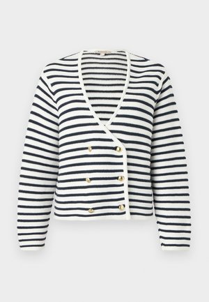 Ribipatsikatel, millel on V-kaelus, valmistatud ribakoonilisest materjalist. Värviskeem on tumesinine ja valge, kuldsete nööbikaunistustega. Lühendatud disain.