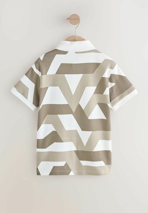 Polo à manches courtes avec un motif géométrique beige et blanc. Fabriqué en tissu doux, avec un col boutonné et une boucle de suspension.