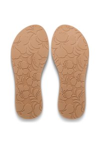 Καφέ πέλματα με λουλουδένιο μοτίβο, που διαθέτουν υφή και ανάγλυφο όνομα της μάρκας "ROXY" ενσωματωμένο στο σχέδιο.