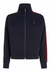 Giacca zip-up navy con collo alto, caratterizzata da accenti a strisce bianche e rosse sulle maniche. Tessuto morbido con polsini e orlo a coste.