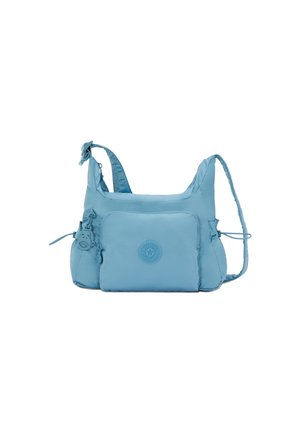 Light blue nylon shoulder bag with adjustable strap, zippered pocket, and embossed logo. Soft texture and rounded shape with side ties.