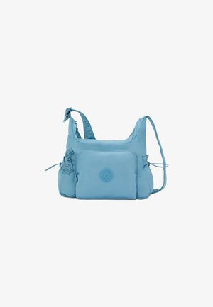 Sac à bandoulière en nylon bleu clair avec sangle réglable, poche zippée et logo en relief. Texture douce et forme arrondie avec des liens sur les côtés.