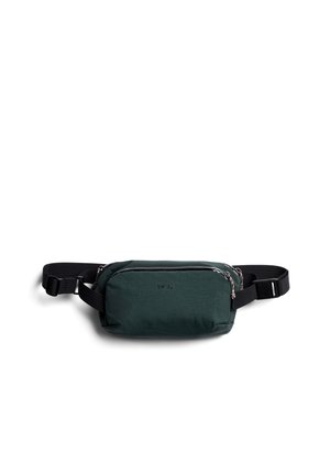 Green, rectangular bag made from lightweight fabric with a front zipper pocket, black strap, and logo embossed on the side.