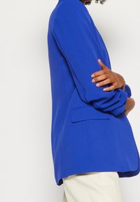 Marks & Spencer Kort kappa / rock - blue