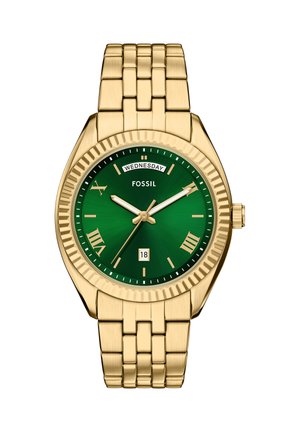 Montre-bracelet en métal doré avec cadran vert, chiffres romains, guichet jour à 12 heures, guichet date à 6 heures et mouvement à trois aiguilles.