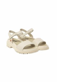 Sandalias beige con correas anchas en los dedos y correas en el tobillo. Hechas de material sintético, con una suela texturizada y un diseño sencillo.