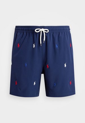 Mornarska kopalna kratka hlače z elastičnim pasom in vrvico. Opremljene so z zapletenimi vezenimi logotipi polo v rdeči, beli in modri barvi po celotni tkanini.