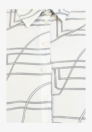 White blouse with black linear pattern, featuring a pointed collar, button front with round buttons, and smooth, lightweight fabric.