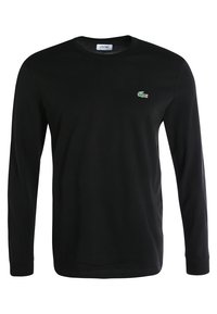 Black long-sleeve T-shirt made of cotton, featuring a small green crocodile logo on the left chest. Round neck, standard fit, and smooth texture.