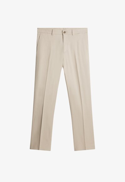 Bežideltatud püksid kergest kangast, millel on lame eesosa, küljetaskud ja ühekohaline nööbiga sulgemine. Sile tekstuur.