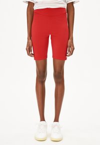 Rode fietsbroekjes van rekbaar materiaal, met een hoge taille en een knielange snit. Naadloos ontwerp met een zachte textuur.