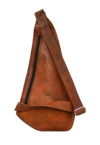 Brown leather sling bag with a smooth texture, asymmetrical shape, and a zipper closure. Features a wide strap with adjustable metal buckle.