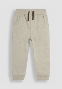 Pantalones de chándal gris claro hechos de una tela suave. Tienen una cintura elástica con cordones marrones, bolsillos laterales y puños en los tobillos.
