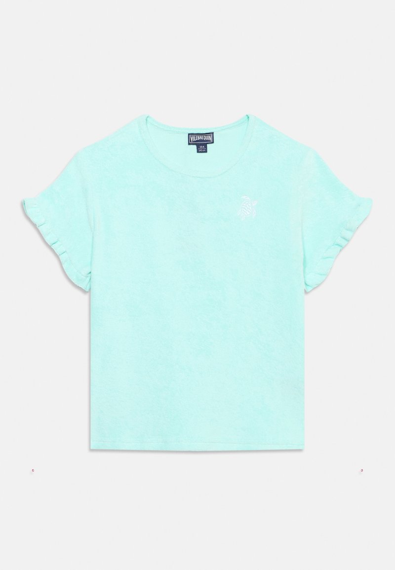 Φωτεινό γαλάζιο μπλουζάκι για παιδάκια με κοντά μανίκια και βολάν στα μανίκια, με μικρό λευκό κεντητό λογότυπο χελώνας στο αριστερό άνω μέρος του στήθους.