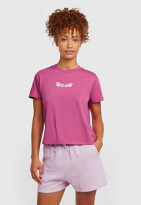 Short-sleeve, pink cotton t-shirt with a floral graphic and a round neckline, paired with light purple textured shorts featuring an elastic waistband.