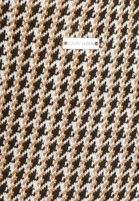Knit fabric featuring a houndstooth pattern in black, white, and gold, with a rectangular tag reading "LASCANA" attached.
