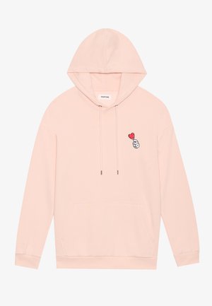 Svetlo roza kapuca iz mehke tkanine, z sprednjim žepom, nastavljivimi vrvicami in vezenim motivom roke s srcem.