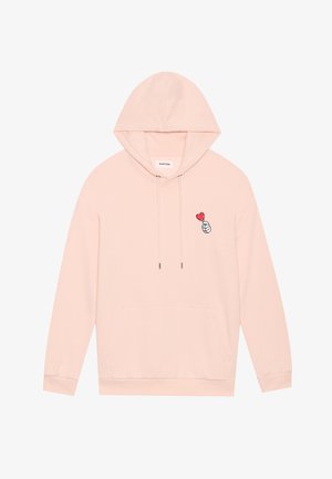 Svetlo roza kapuca iz mehke tkanine, z sprednjim žepom, nastavljivimi vrvicami in vezenim motivom roke s srcem.