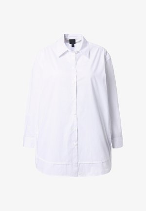 Valkoinen pitkähihainen nappipaita, jossa on kärjelliset kaulukset, rento malli ja pehmeä puuvillakangas. Ominaisuuksiin kuuluvat etunapit ja sivuhalkiot.