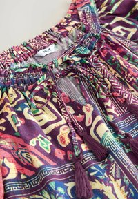 Unselected, purple geometric paisley print