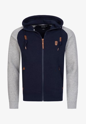 Navy and grey zip-up hoodie with a drawstring hood, contrasting sleeves, leather accents, and side pockets. Soft, textured fabric.