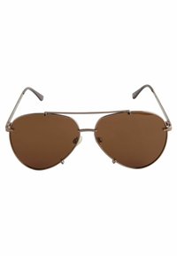 Bruine aviator zonnebril met een metalen frame, slanke pootjes en bruin getinte lenzen. Heeft een dubbele brugontwerp en verstelbare neuspad.