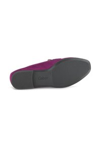 Fuchsia suede flat shoe with a textured black rubber sole. Gabor logo printed on the sole, features an adjustable strap for secure fit.