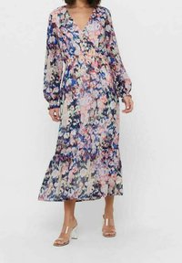 Floral maxi dress with a v-neck, long sheer sleeves, and a tiered hem. Features a multicolored pattern in blue, pink, and white.