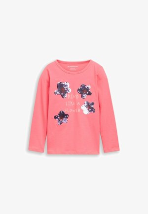 Roze kinderkleding met lange mouwen, met vier paarse en witte pailletten bloemen en de tekst "Kind like a flower" aan de voorkant.