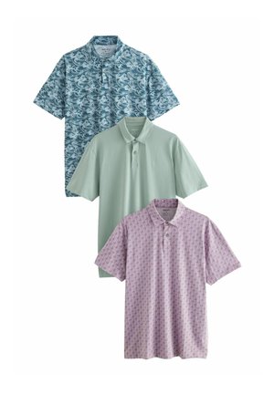 Three polo shirts: top in blue wave pattern, middle in solid mint green, bottom in light pink with small diamond pattern. Each features a collar.