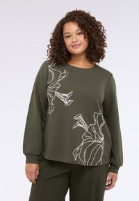 Khaki mikina s dlouhými rukávy, na přední straně zdobena bílou a růžovou květinovou liniovou grafikou. Měkký materiál a uvolněný střih.
