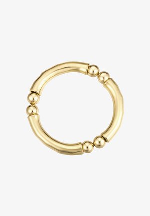 Auksinės spalvos apyrankė, kurioje derinami sklandūs, kreivi strypai ir apvalūs karoliukai. Dizainas yra vientisas, su lygia, blizgia apdaila.