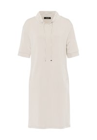 Robe sweat beige clair avec des manches courtes, un col à cordon et des poches latérales. Texture douce et lisse avec une silhouette décontractée.