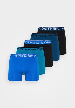 Blå bomulds-boxershorts med en tætsiddende design, der har en bred hvid elastik i taljen med "BJÖRN BORG" branding foroven. Glat tekstur.