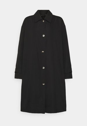 Manteau noir longueur genoux avec col pointu, cinq boutons devant, manches longues et poches latérales, présenté sur fond blanc.