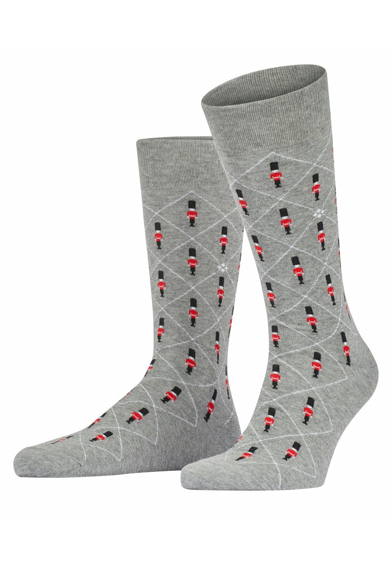 Calzini grigi con un motivo a diamante e piccole decorazioni di soldatini giocattolo rossi e neri, realizzati in un morbido materiale testurizzato.