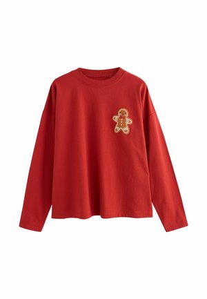 Rød langærmet bomulds t-shirt med rund hals, der har en peberkagemand-applikation på brystet i brun, hvid og orange.