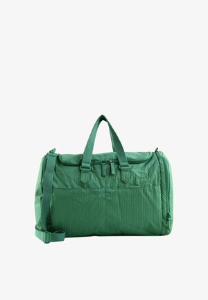 Sac de sport vert texturé avec doubles poignées, fermeture éclair et bandoulière réglable sur fond blanc.