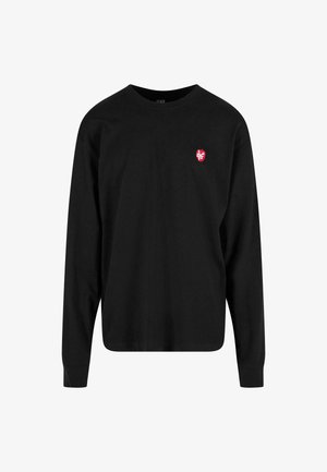 Black long-sleeve t-shirt made of cotton, featuring a red shield logo on the left chest area. Crew neck with a relaxed fit.
