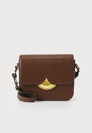 Brown textured handbag with a curved gold accent on the flap, an adjustable strap, and a compact rectangular shape.