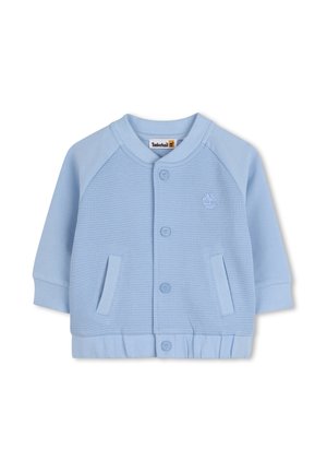 Lichtblauw jack met knopen, bestaande uit een gestructureerd lijf, effen mouwen, geribde boorden en zoom. Heeft twee voorzakken en een logo-accent.