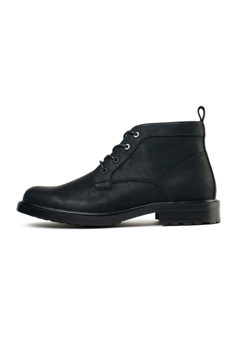 Black leather ankle boot with a rounded toe, two eyelet lacing, and a pull tab. Features a textured surface and a low, durable rubber sole.