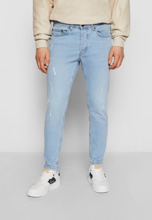 Pieguloša piegriezuma džinsi - blue