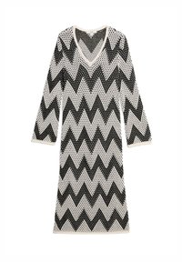 Abito lavorato a maglia bianco e nero a zigzag con maniche a tre quarti e scollatura a V, caratterizzato da una trama a intreccio aperto.