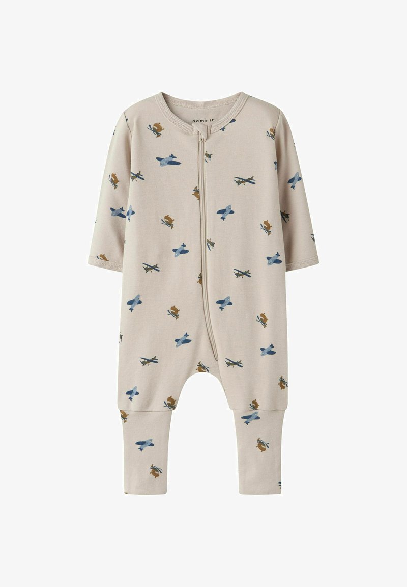 Rompers in cotone beige con maniche lunghe e chiusura a zip, caratterizzato da aerei blu e scoiattoli marroni stampati su tutto il capo. Tessuto morbido ed elasticizzato.