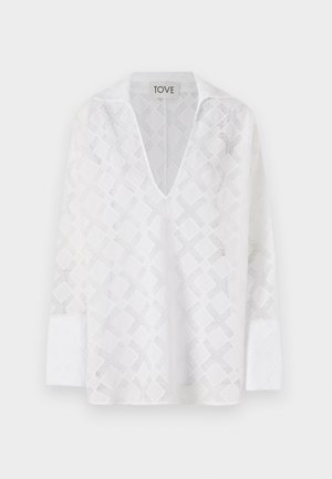 Valge pikakä sleevesärk sügava V-kaeluse ja diamond-mustriga, millel on tekstureeritud kangas. Etiketil on kirjas "TOVE".