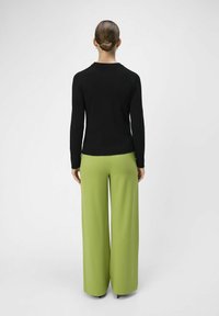 Object OBJLISA WIDE NOOS - Trousers - peridot