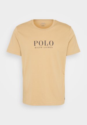 Lühiadeelsed, ümarate kaelustega T-särk peenes kollases puuvillas, mille keskosas on tumesinistes tähtedes "POLO RALPH LAUREN" logo.