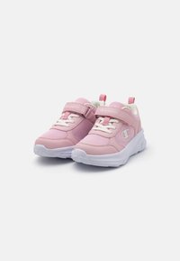 Pink athletic shoes with mesh and synthetic upper, white rubber soles, laces, and adjustable velcro strap. Champion logo on the side.