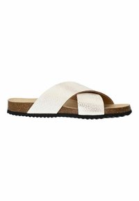 Sandale en cuir blanc avec des brides croisées, surface texturée, semelle intermédiaire en liège et semelle extérieure en caoutchouc noir avec un motif ondulé.
